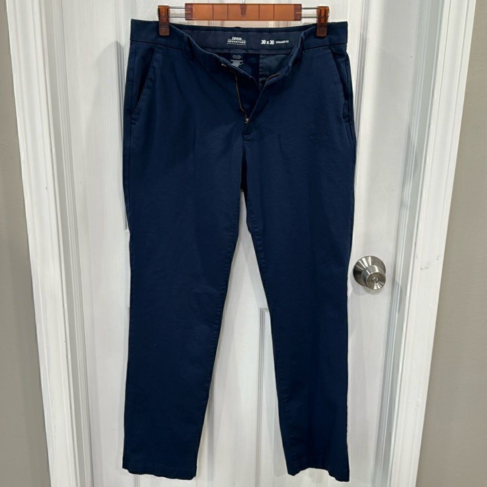 IZOD PERFORMANCE TROUSERS.